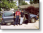 Tim and Robert, in front of minivan, getting ready to travel